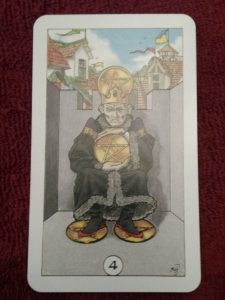 4 of Pentacles from Robin Wood deck 