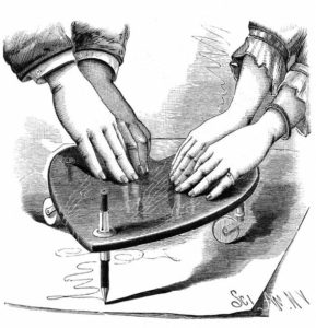 Line drawing of hands on a planchette