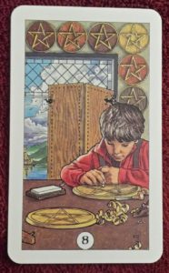 Photo of the Eight of Pentacles from the Robin Wood tarot deck